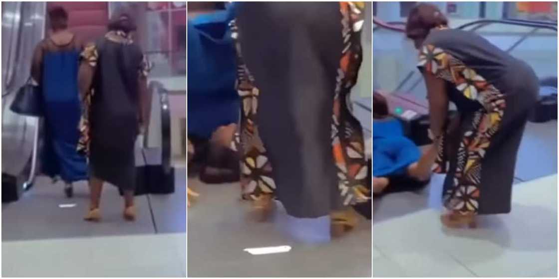 Woman falling from escalator Woman falling from escalator