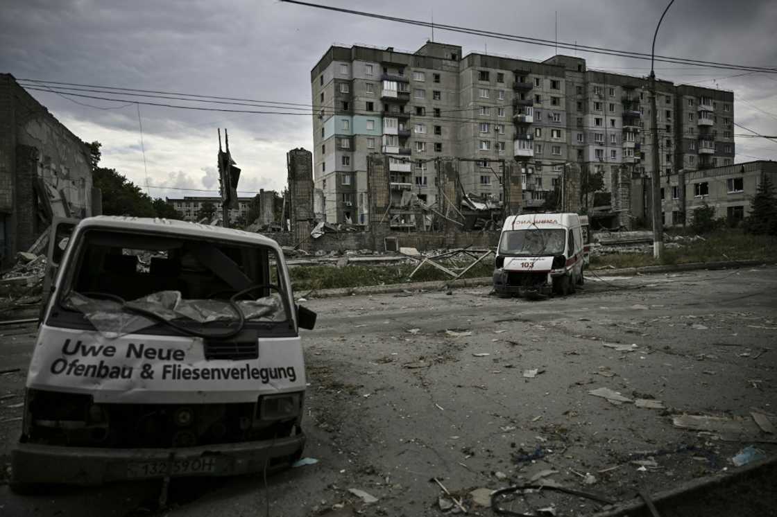 In Lysychansk, there are signs of preparations for street fighting: soldiers digging in, putting up barbed wire and police placing burnt-out vehicles sideways across roads to slow traffic