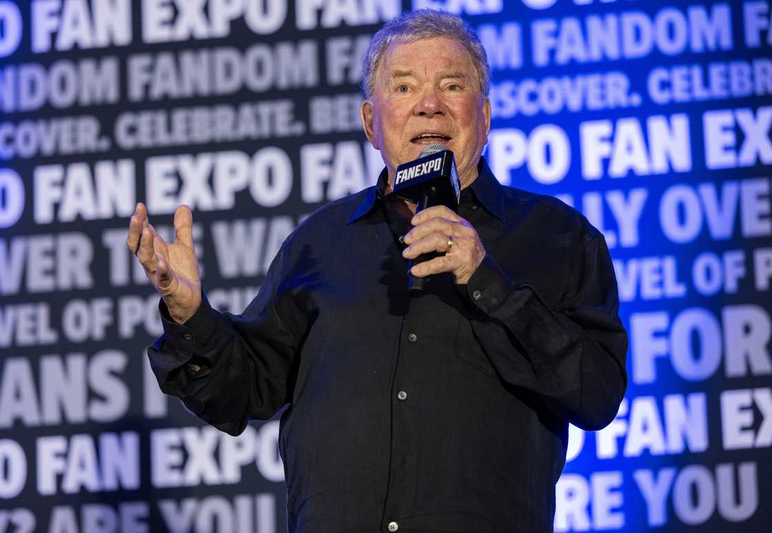 William Shatner holding a mic