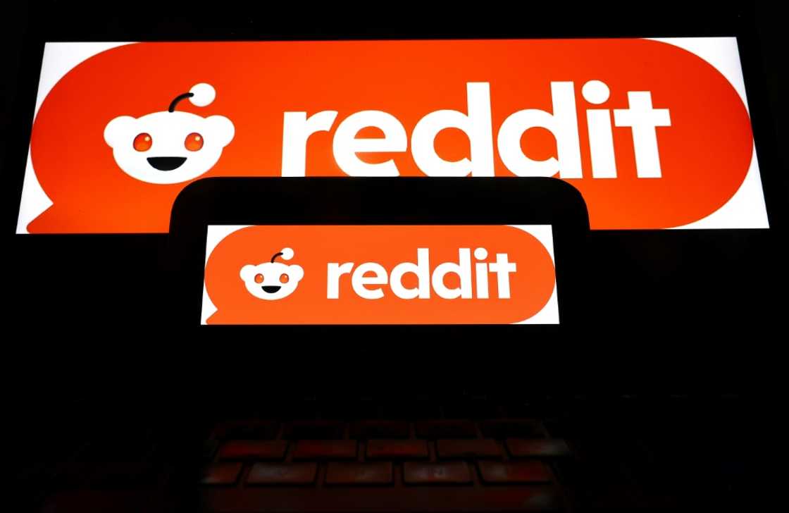 The Reddit logo displayed on a cell phone and computer monitor The Reddit logo displayed on a cell phone and computer monitor