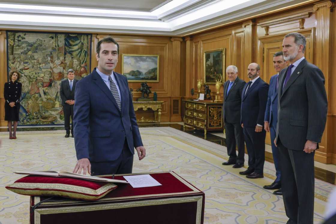 Spain’s new Economy Minister, Carlos Cuerpo, swears on the constitution in front of Spain's King Felipe VI during a ceremony at la Zarzuela Palace in Madrid Spain’s new Economy Minister, Carlos Cuerpo, swears on the constitution in front of Spain's King Felipe VI during a ceremony at la Zarzuela Palace in Madrid