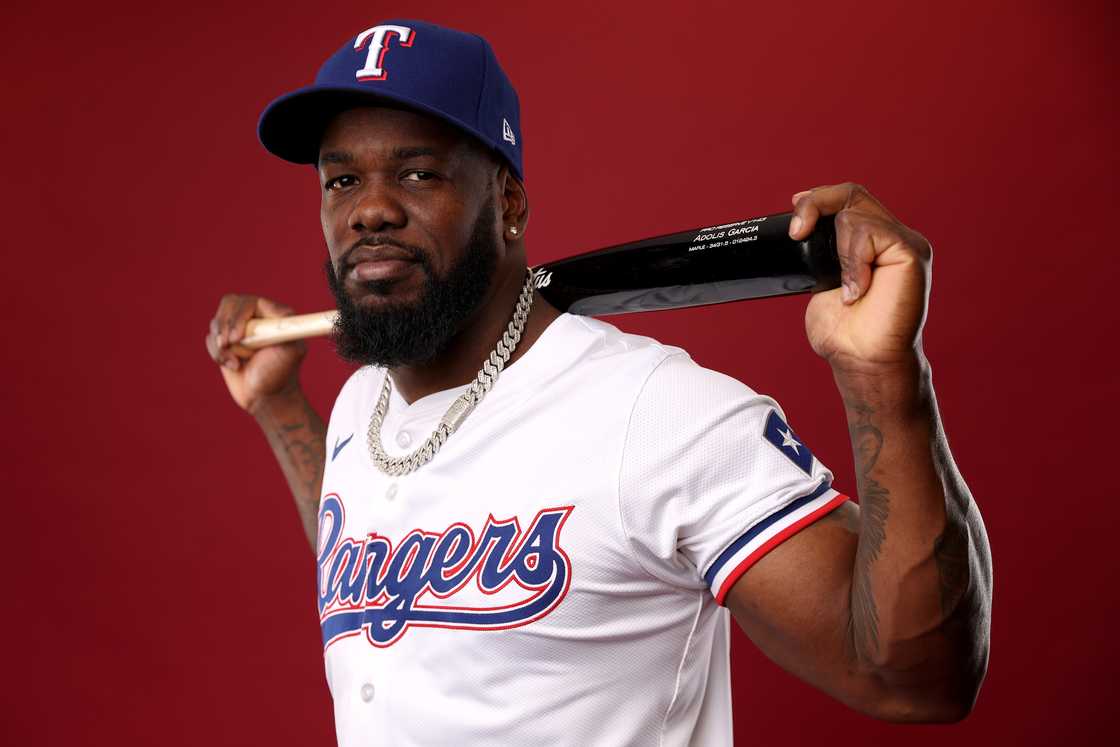 Adolis Garcia poses for a portrait during photo day at Surprise Stadium