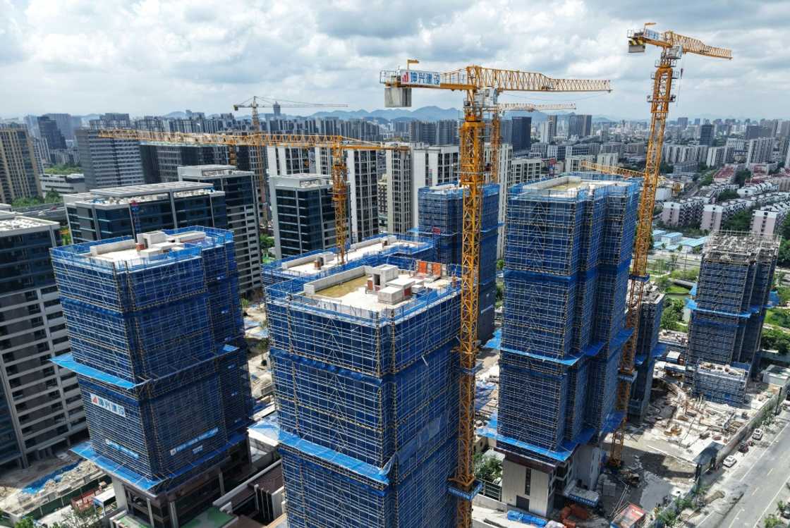 Buildings under construction in Hangzhou, in China’s eastern Zhejiang province. Beijing has struggled to fully reignite the world's number two economy since the end of the Covid-19 pandemic, with the once-booming property sector mired in a debt crisis and exports facing mounting headwinds Buildings under construction in Hangzhou, in China’s eastern Zhejiang province. Beijing has struggled to fully reignite the world's number two economy since the end of the Covid-19 pandemic, with the once-booming property sector mired in a debt crisis and exports facing mounting headwinds