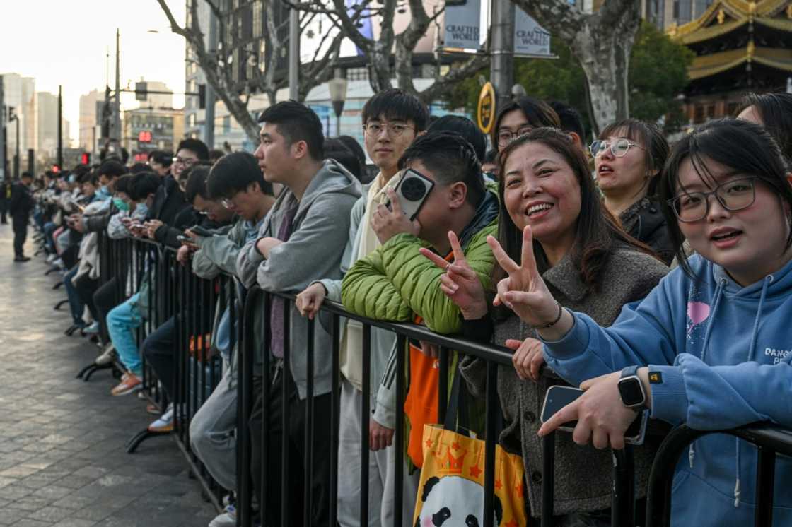 Customers lined up sometimes for days outside of Shanghai's new Apple retail store before its grand opening Customers lined up sometimes for days outside of Shanghai's new Apple retail store before its grand opening