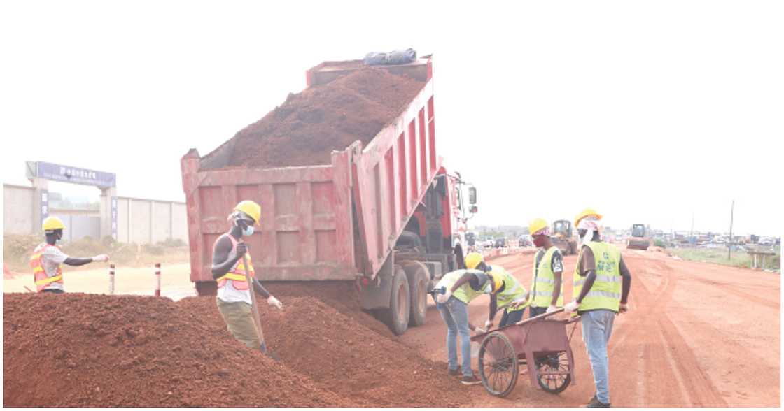 Workers at the beach road