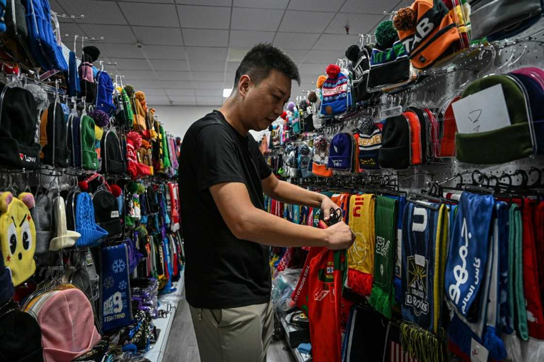 Tariff fears are hurting World Cup merchandise orders at Shang Yabing's Chinese knitwear factory, where racks of scarves bear the logos of national teams from Ireland to Tanzania Tariff fears are hurting World Cup merchandise orders at Shang Yabing's Chinese knitwear factory, where racks of scarves bear the logos of national teams from Ireland to Tanzania