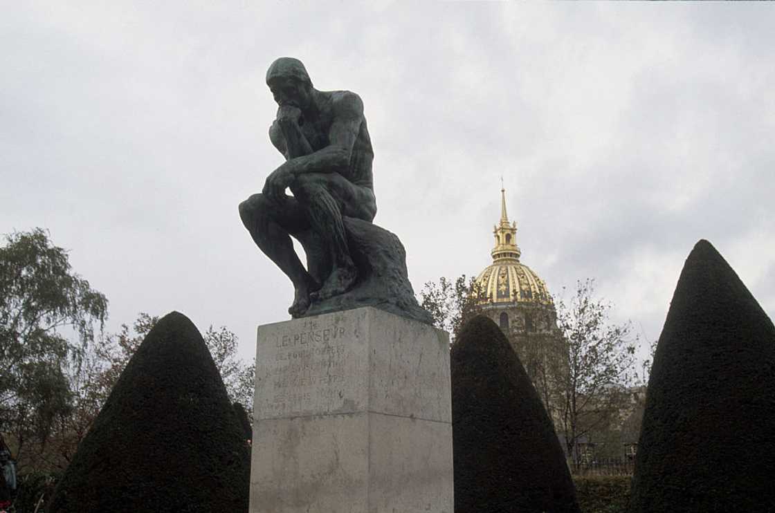 Auguste Rodin's sculpture The Thinker sits in a garden at the Musée Rodin in Paris, France. Auguste Rodin's sculpture The Thinker sits in a garden at the Musée Rodin in Paris, France.