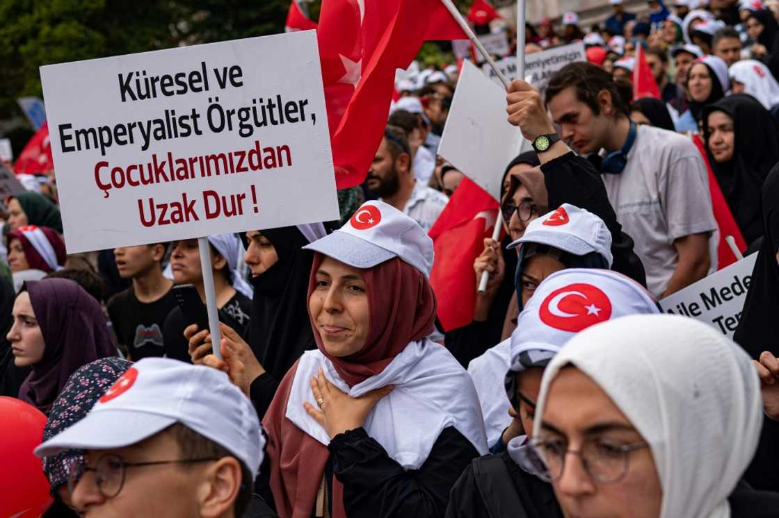 A protester holds a placard during an anti-LGBT rally organised by pro-Islamic organizations in Istanbul on September 18, 2022 A protester holds a placard during an anti-LGBT rally organised by pro-Islamic organizations in Istanbul on September 18, 2022