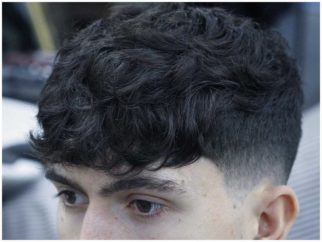 Dark taper fade with bangs