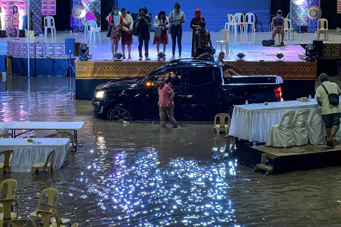 Landslides and flooding kill 13 people and leave seven missing in the southern Philippines Landslides and flooding kill 13 people and leave seven missing in the southern Philippines