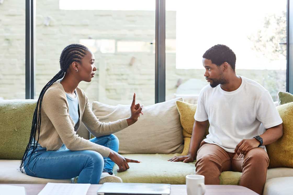 A young couple disagreeing A young couple disagreeing