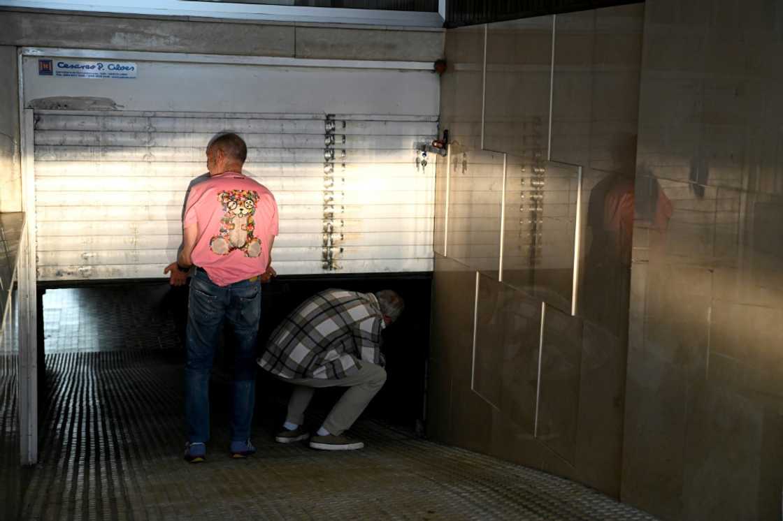 Local residents had to manually open the gates of an underground parking lots Local residents had to manually open the gates of an underground parking lots
