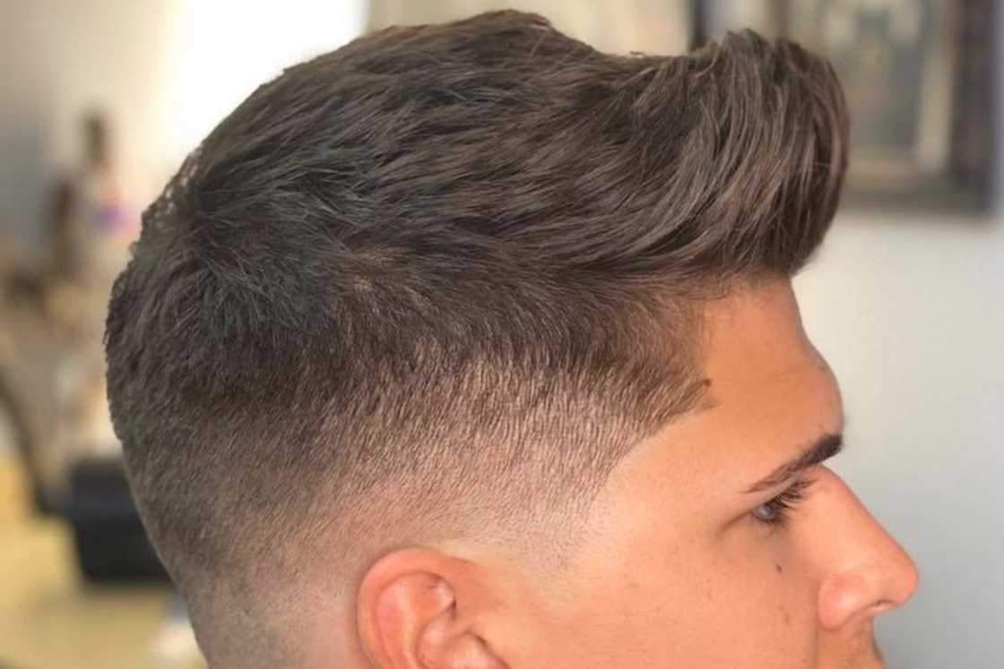 Taper skin fade with a textured quiff Taper skin fade with a textured quiff