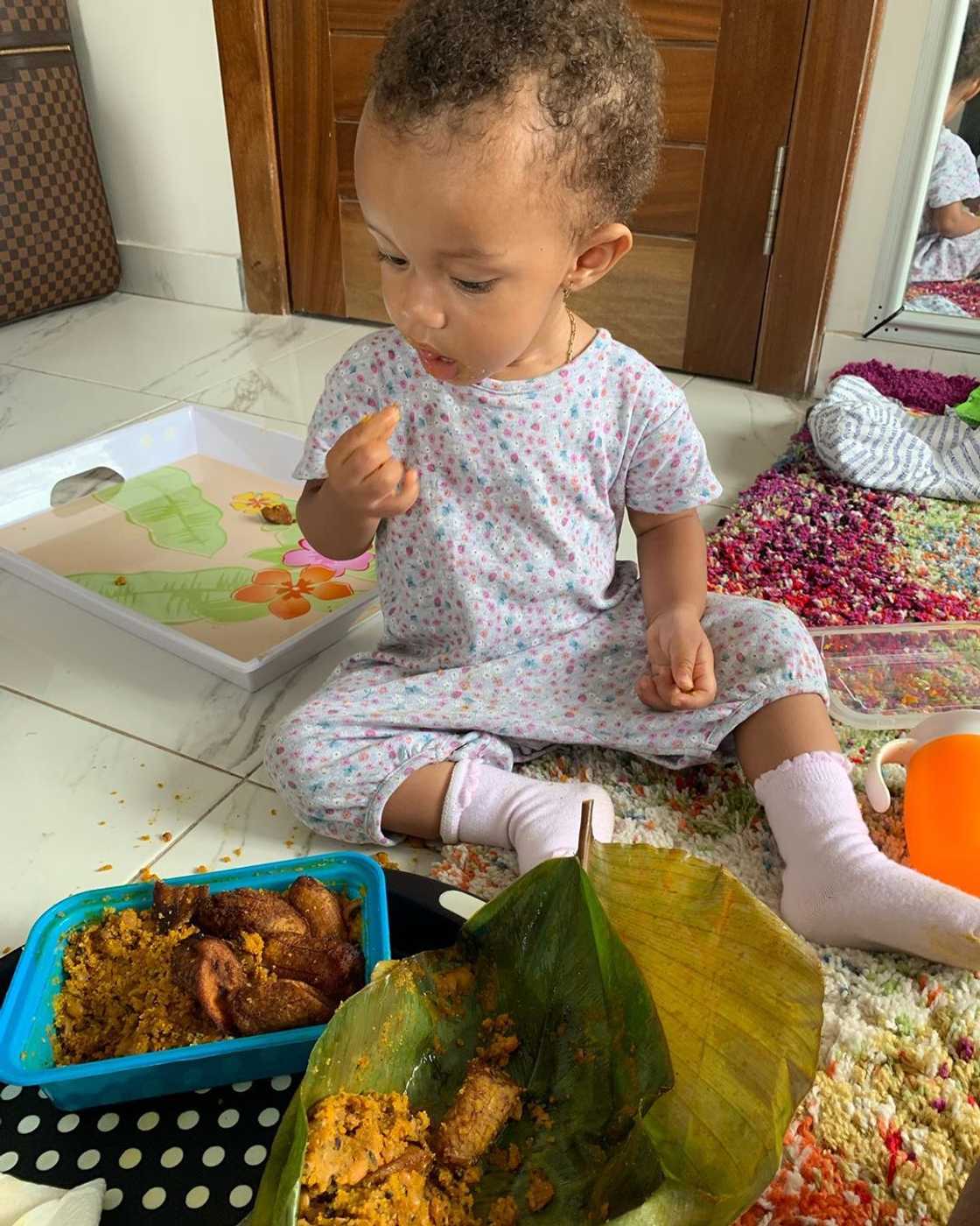 Yvonne Nelson's daughter Ryn spotted eating beans and gari (Photo) Yvonne Nelson's daughter Ryn spotted eating beans and gari (Photo)