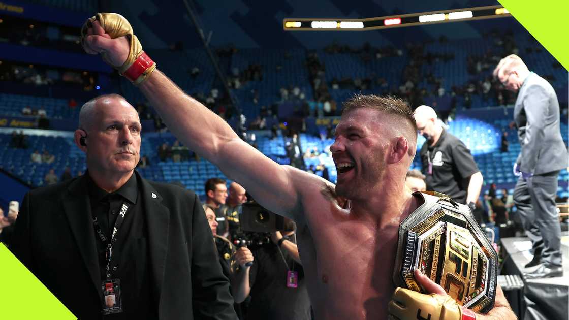 Dricus du Plessis celebrates after beating Israel Adesanya at UFC 305. Dricus du Plessis celebrates after beating Israel Adesanya at UFC 305.