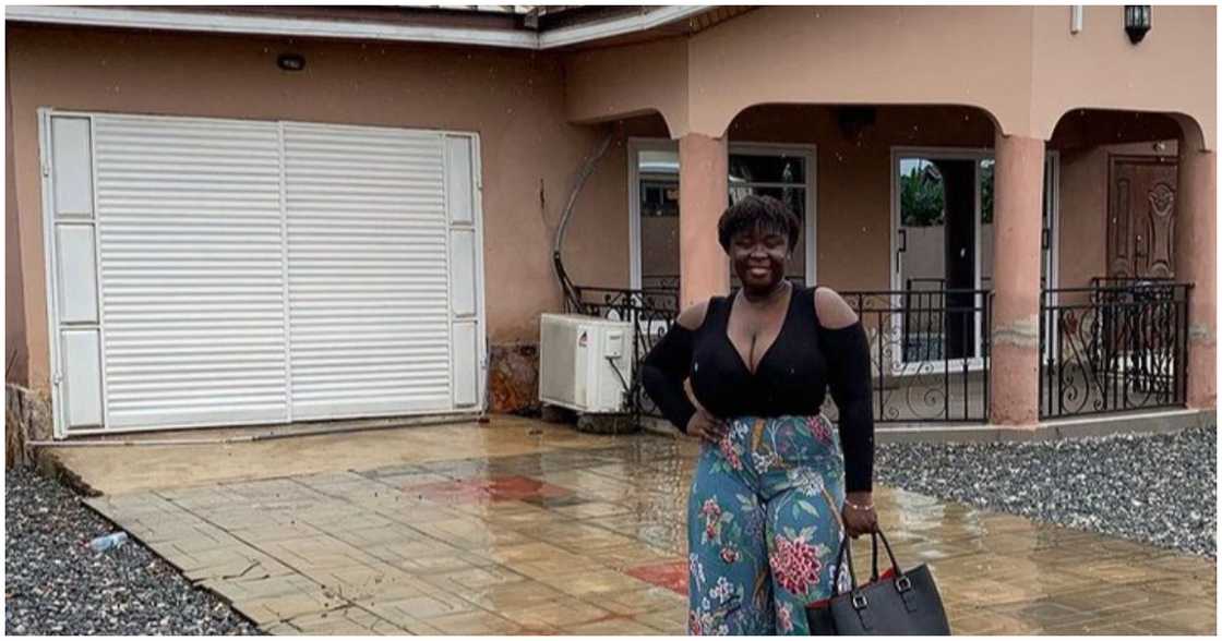 Kumawood actress poses in front of her house Kumawood actress poses in front of her house
