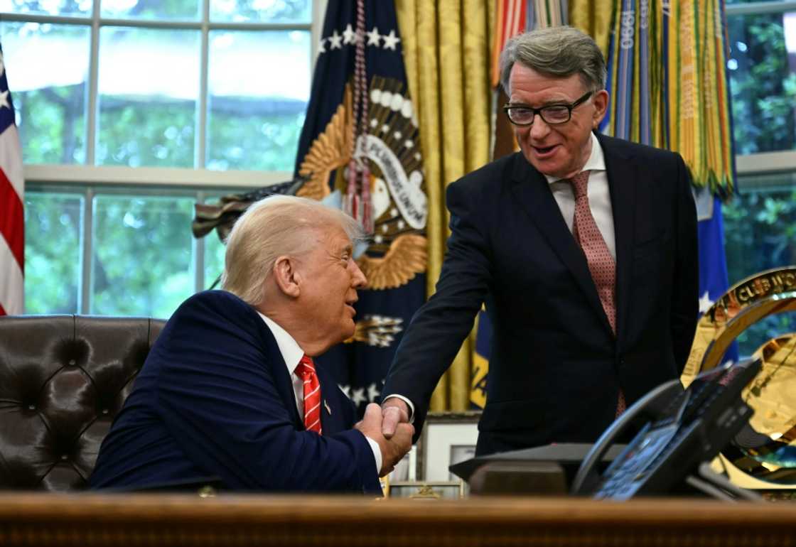 US automakers are critical of a new trade deal that favors British automakers, which was announced with a press event with US President Donald Trump shaking hands with British ambassador to the United States Peter Mandelson at the White House US automakers are critical of a new trade deal that favors British automakers, which was announced with a press event with US President Donald Trump shaking hands with British ambassador to the United States Peter Mandelson at the White House