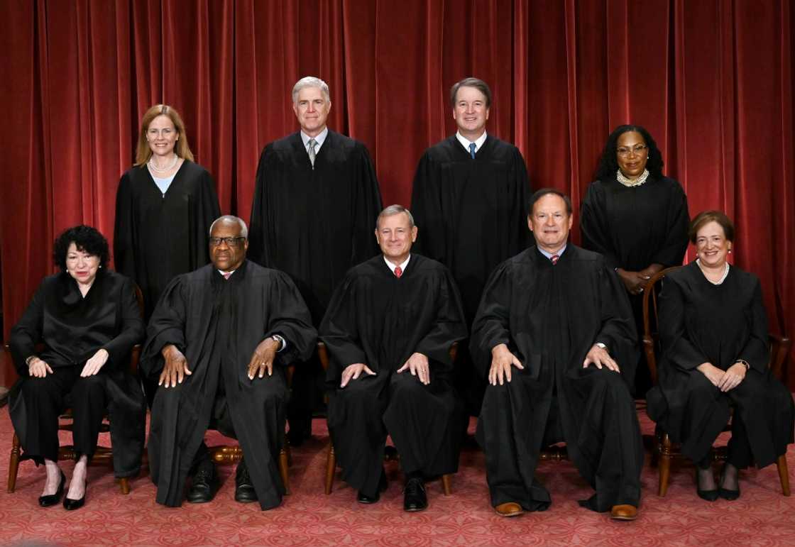 The nine justices of the US Supreme Court pose for their official photo The nine justices of the US Supreme Court pose for their official photo