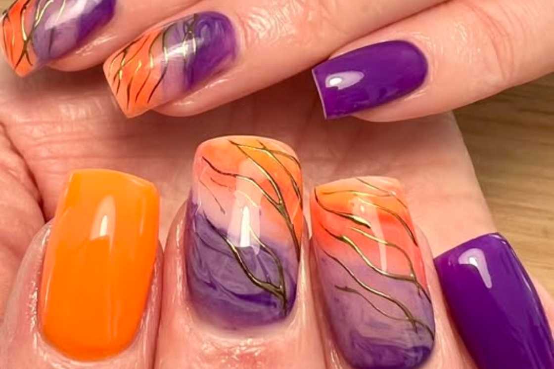 Purple and orange nails Purple and orange nails