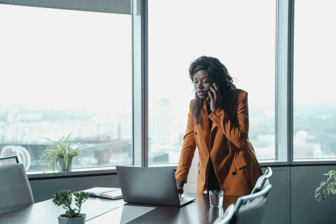 A woman in a brown blazer