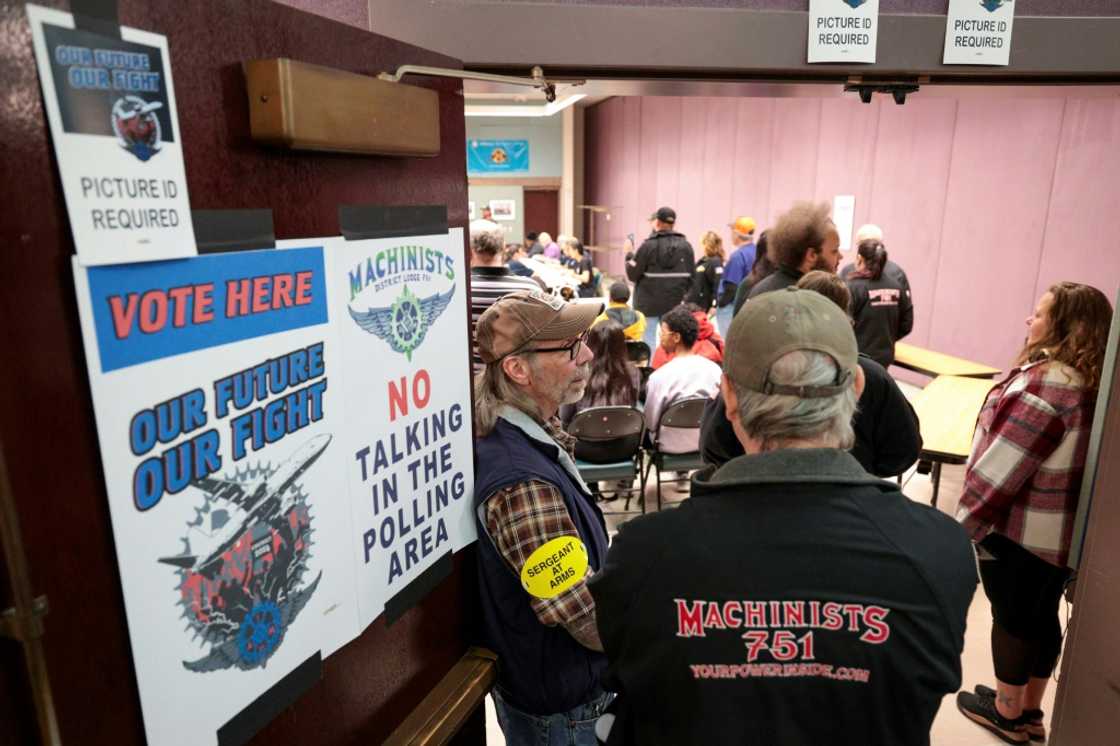 People look on as the Boeing Machinist union tallies votes on the latest Boeing contract offer at the District Lodge 751 Union Hall in Seattle, Washington on November 4, 2024 People look on as the Boeing Machinist union tallies votes on the latest Boeing contract offer at the District Lodge 751 Union Hall in Seattle, Washington on November 4, 2024