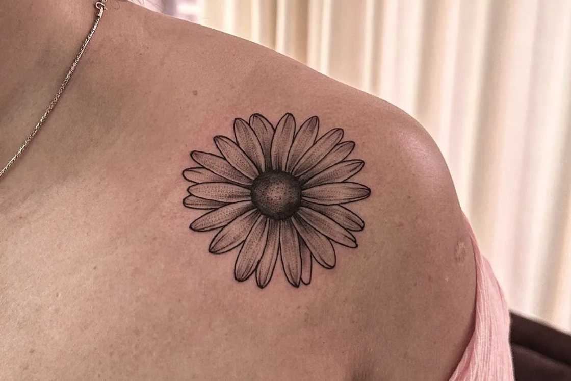 A front shoulder black and white sunflower tattoo A front shoulder black and white sunflower tattoo
