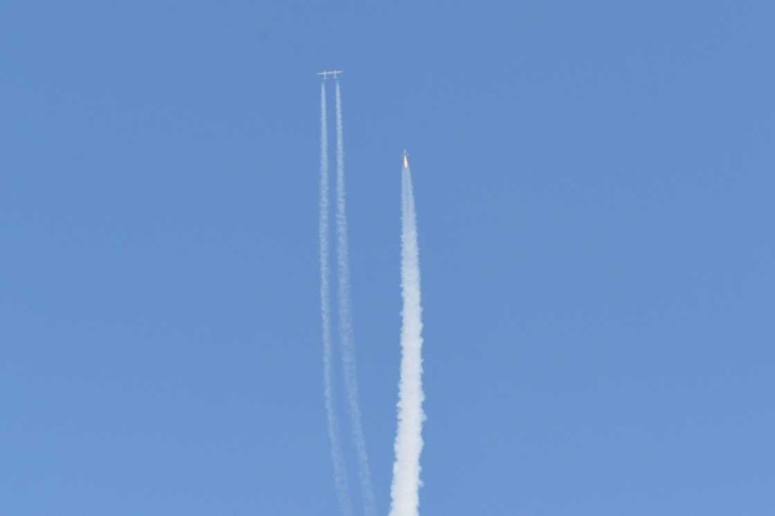 The Virgin Galactic SpaceShipTwo space plane Unity and mothership separate as they fly way above Spaceport America in New Mexico on July 11, 2021