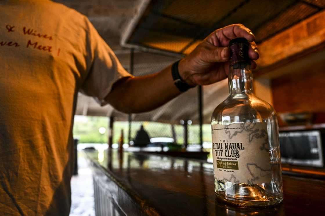 An empty bottle of rum specially made for members of the Royal Naval Tot Club is seen during the group's daily toast