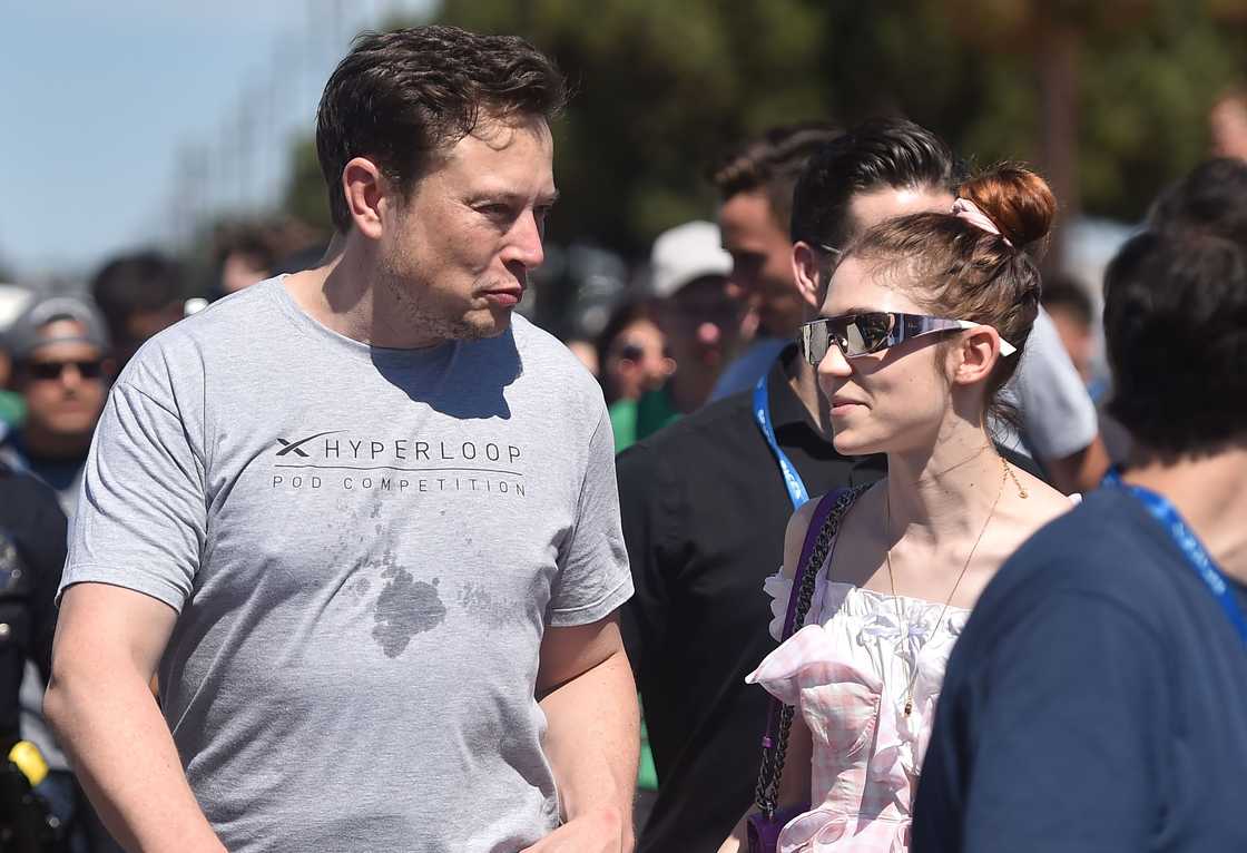 Elon Musk (L) and Grimes (R) attend the 2018 Space X Hyperloop Pod Competition Elon Musk (L) and Grimes (R) attend the 2018 Space X Hyperloop Pod Competition