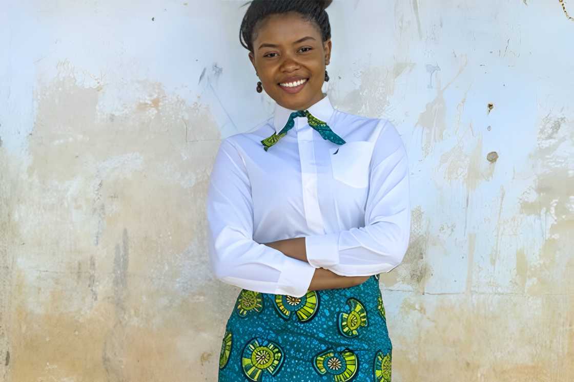 A lady with a white blouse and bow tie