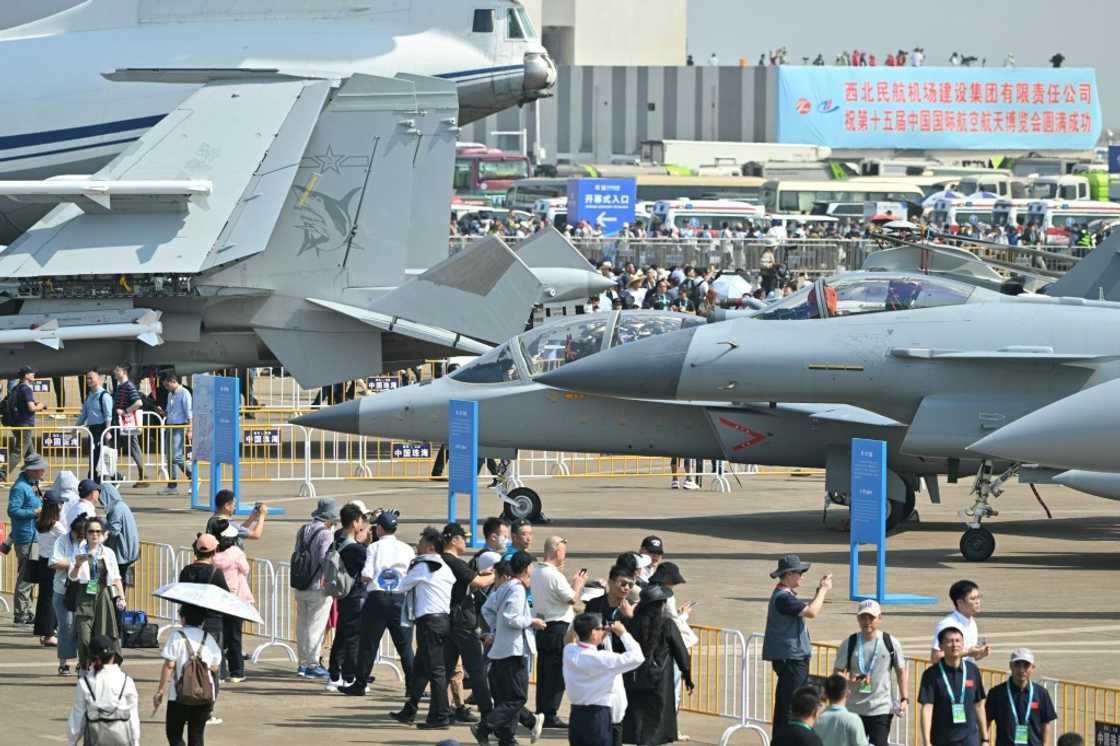 Visitors are seen near the Chinese-made Chengdu J-10 Vigorous Dragon fighter jet and Hongdu JL-10 advanced jet trainer in Zhuhai Visitors are seen near the Chinese-made Chengdu J-10 Vigorous Dragon fighter jet and Hongdu JL-10 advanced jet trainer in Zhuhai