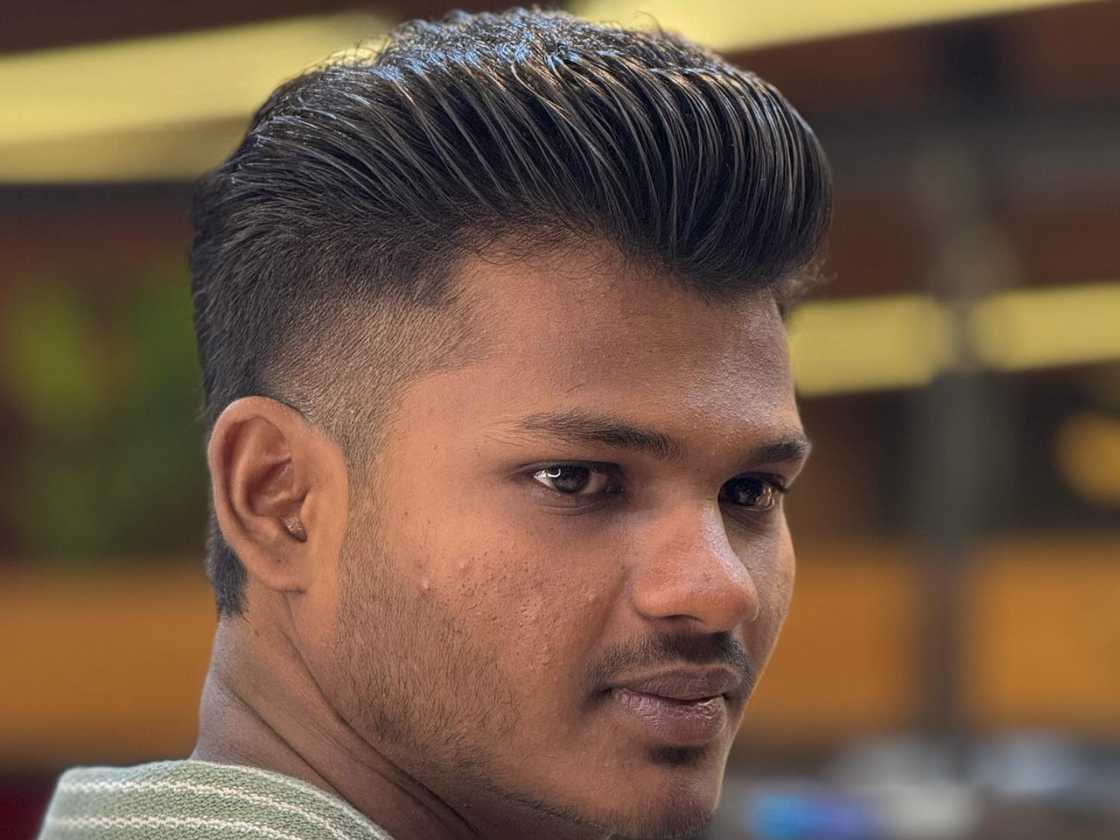 Low tapper fade with slick back Low tapper fade with slick back