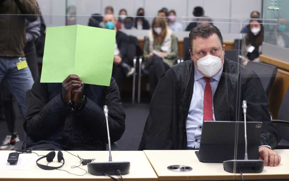 Lowe, pictured with his face covered at the opening of his trial in Celle on April 25 Lowe, pictured with his face covered at the opening of his trial in Celle on April 25