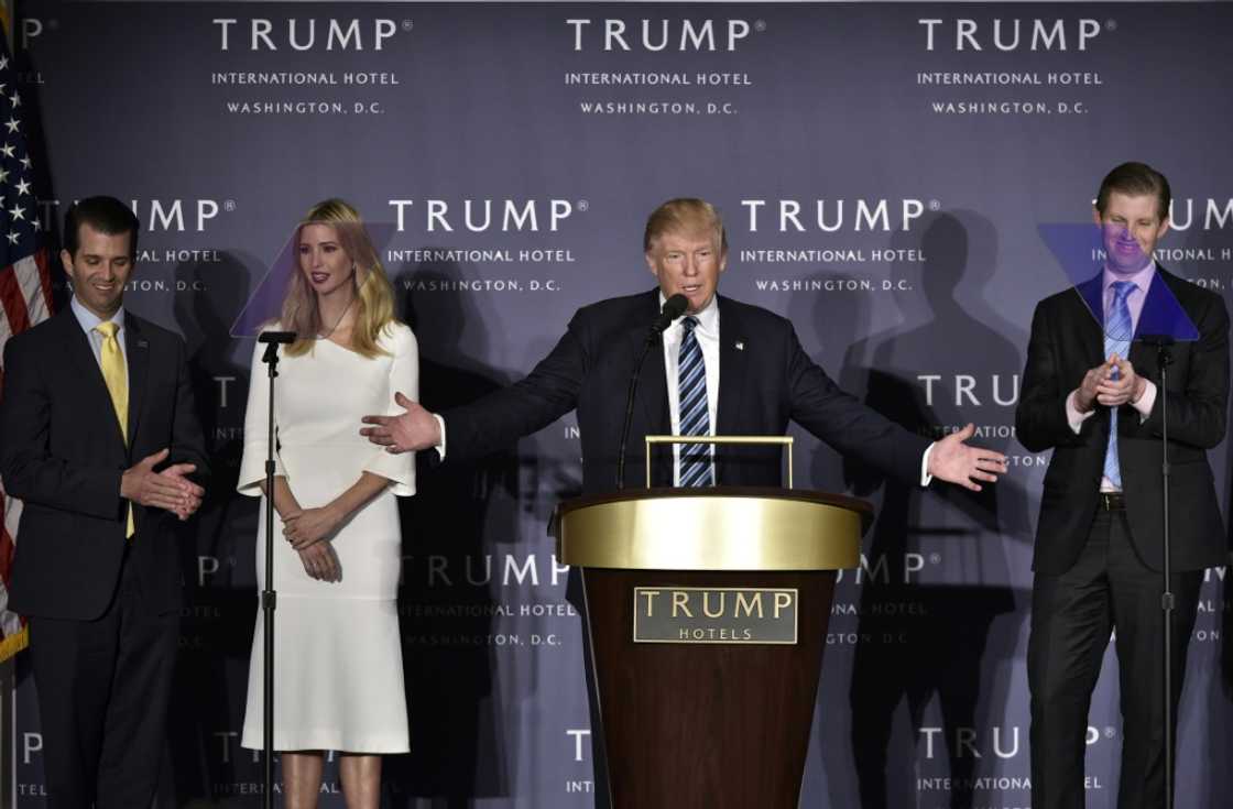 Donald Trump, with children (L-R) Donald Trump Jr., Ivanka Trump, and Eric Trump at the opening of the Trump International Hotel in Washington, DC on October 26, 2016