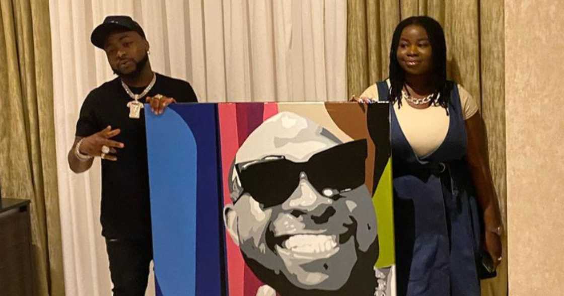 Ghanaian female painter and muralist presents a painting of Davido to him Ghanaian female painter and muralist presents a painting of Davido to him