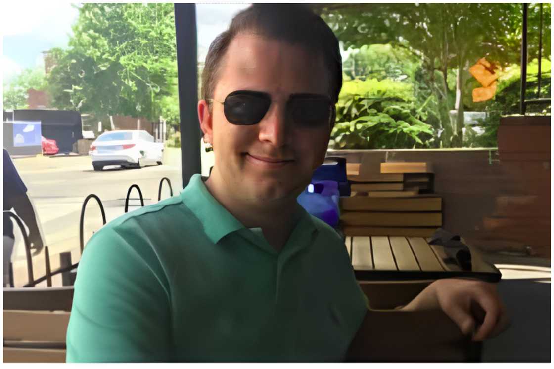John Cummings takes a selfie at a hotel near the roadside. John Cummings takes a selfie at a hotel near the roadside.