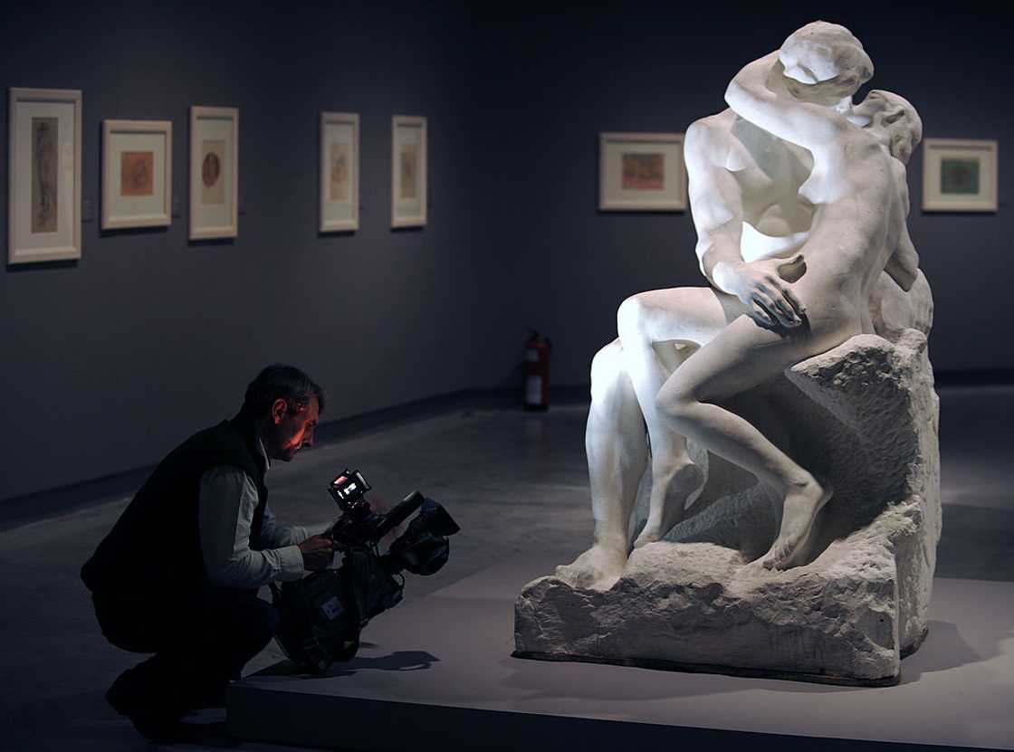 A cameraman films "The kiss" sculpture by French artist Auguste Rodin A cameraman films "The kiss" sculpture by French artist Auguste Rodin