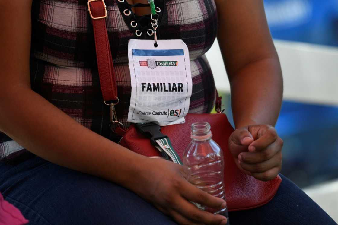 A relative of a missing miner waits for word in the vicinity of the rescue operation A relative of a missing miner waits for word in the vicinity of the rescue operation