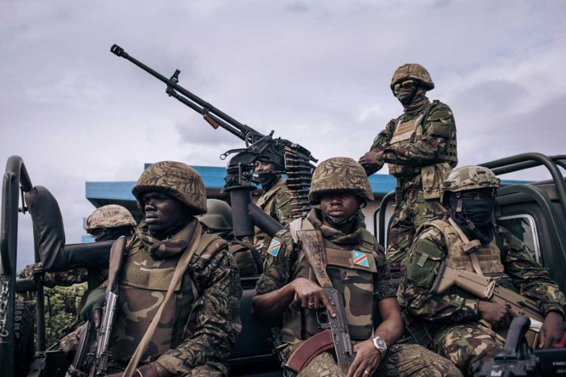 Kenyan and Congolese troops standing guard last week at Goma airport in eastern DR Congo Kenyan and Congolese troops standing guard last week at Goma airport in eastern DR Congo