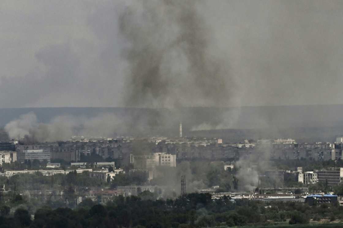 Smoke and dirt rise from the industiral city of Severodonetsk on Friday, where fighting has raged for weeks Smoke and dirt rise from the industiral city of Severodonetsk on Friday, where fighting has raged for weeks