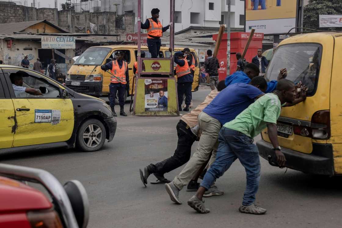 Kinshasa's battered taxis are called 'spirits of death' -- when the government acquired good-quality buses and vans for use as cabs, they became dubbed 'spirits of life' Kinshasa's battered taxis are called 'spirits of death' -- when the government acquired good-quality buses and vans for use as cabs, they became dubbed 'spirits of life'