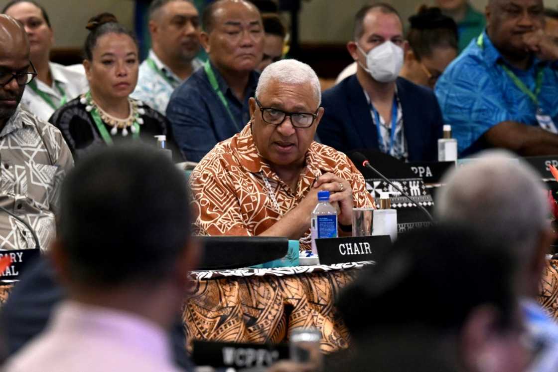 Fijian Prime Minister Frank Bainimarama (C), pictured on July 12, 2022 at the Pacific Islands Forum in Suva, before the arrest of his son in Australia Fijian Prime Minister Frank Bainimarama (C), pictured on July 12, 2022 at the Pacific Islands Forum in Suva, before the arrest of his son in Australia