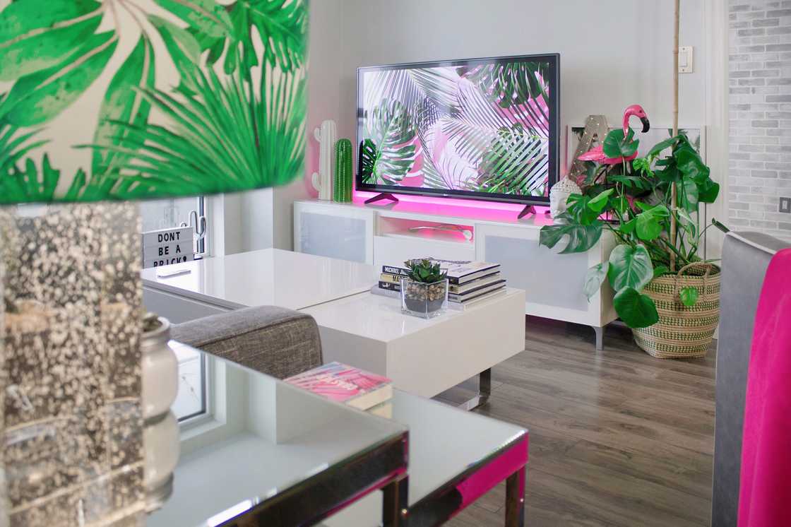A smart television set in a pink-themed living room A smart television set in a pink-themed living room