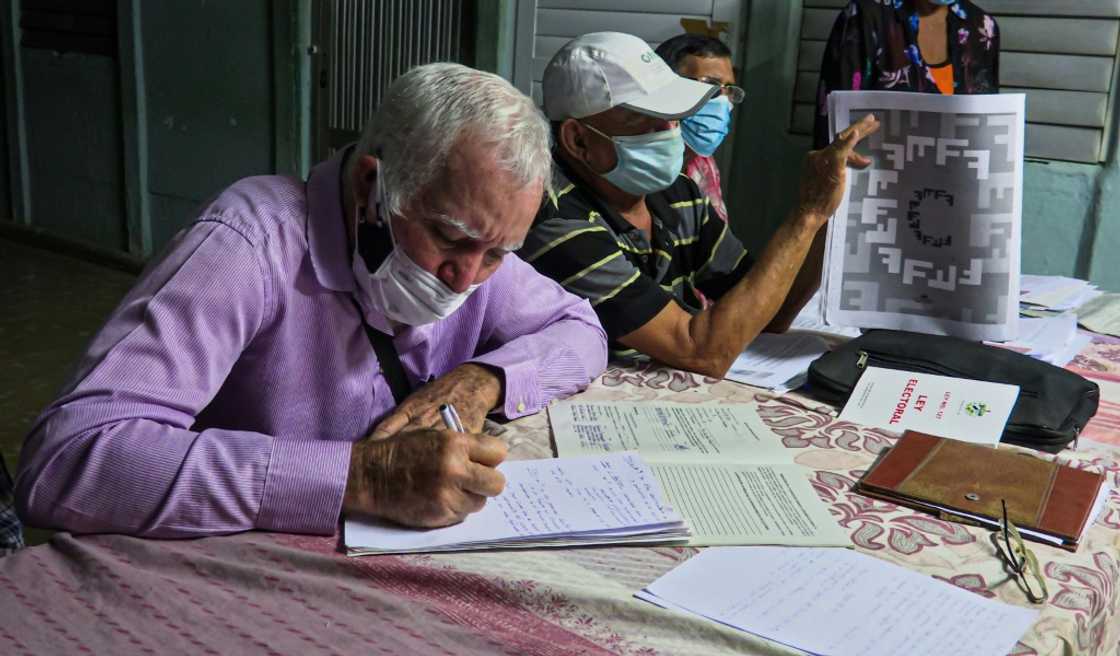 A man takes notes during a meeting called to discuss the potential new Cuban family code, in Havana province's La Lisa municipality in February 2022 A man takes notes during a meeting called to discuss the potential new Cuban family code, in Havana province's La Lisa municipality in February 2022