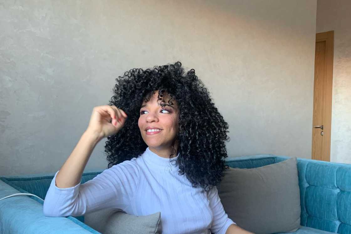 A lady with curly black hair A lady with curly black hair