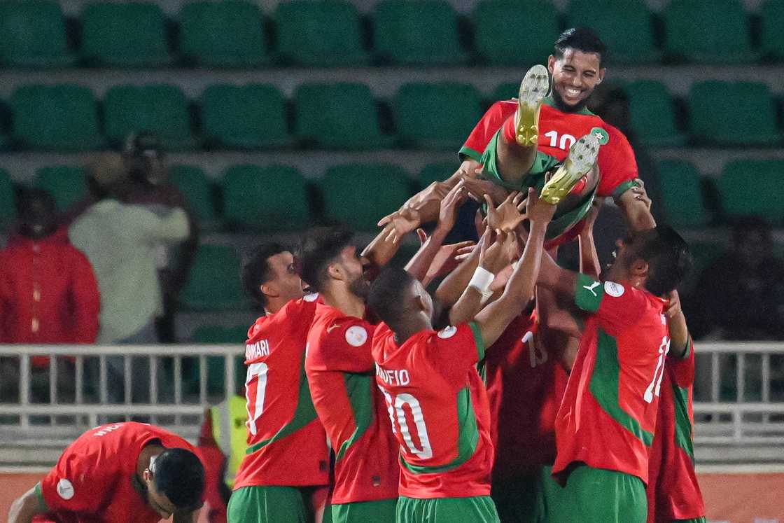 Players of Morocco celebrate after a goal against Zambia. Players of Morocco celebrate after a goal against Zambia.