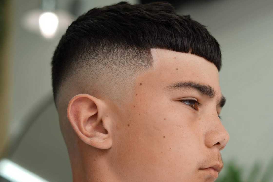 A textured crop with mid-length fade cut