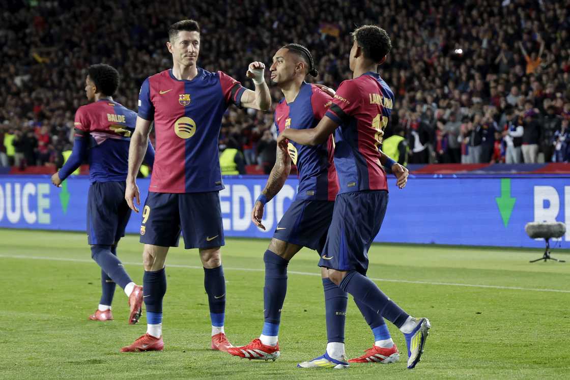 Lamine Yamal of FC Barcelona celebrates 2-1 with Raphinha of FC Barcelona, Robert Lewandowski of FC Barcelona during the UEFA Champions League match between FC Barcelona v Benfica at the Lluis Companys Olympic Stadium on March 11, 2025 in Barcelona Spain Lamine Yamal of FC Barcelona celebrates 2-1 with Raphinha of FC Barcelona, Robert Lewandowski of FC Barcelona during the UEFA Champions League match between FC Barcelona v Benfica at the Lluis Companys Olympic Stadium on March 11, 2025 in Barcelona Spain