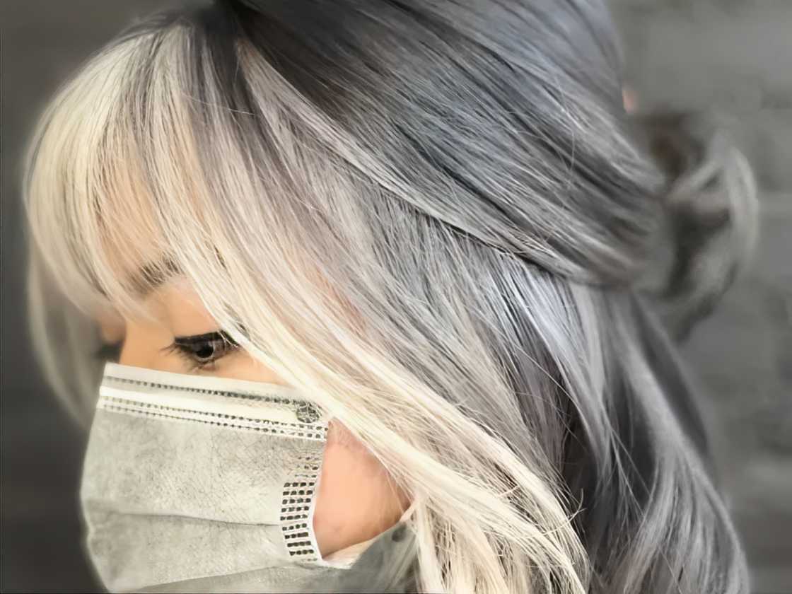 A masked girl is wearing a half-up, half-down hairstyle A masked girl is wearing a half-up, half-down hairstyle