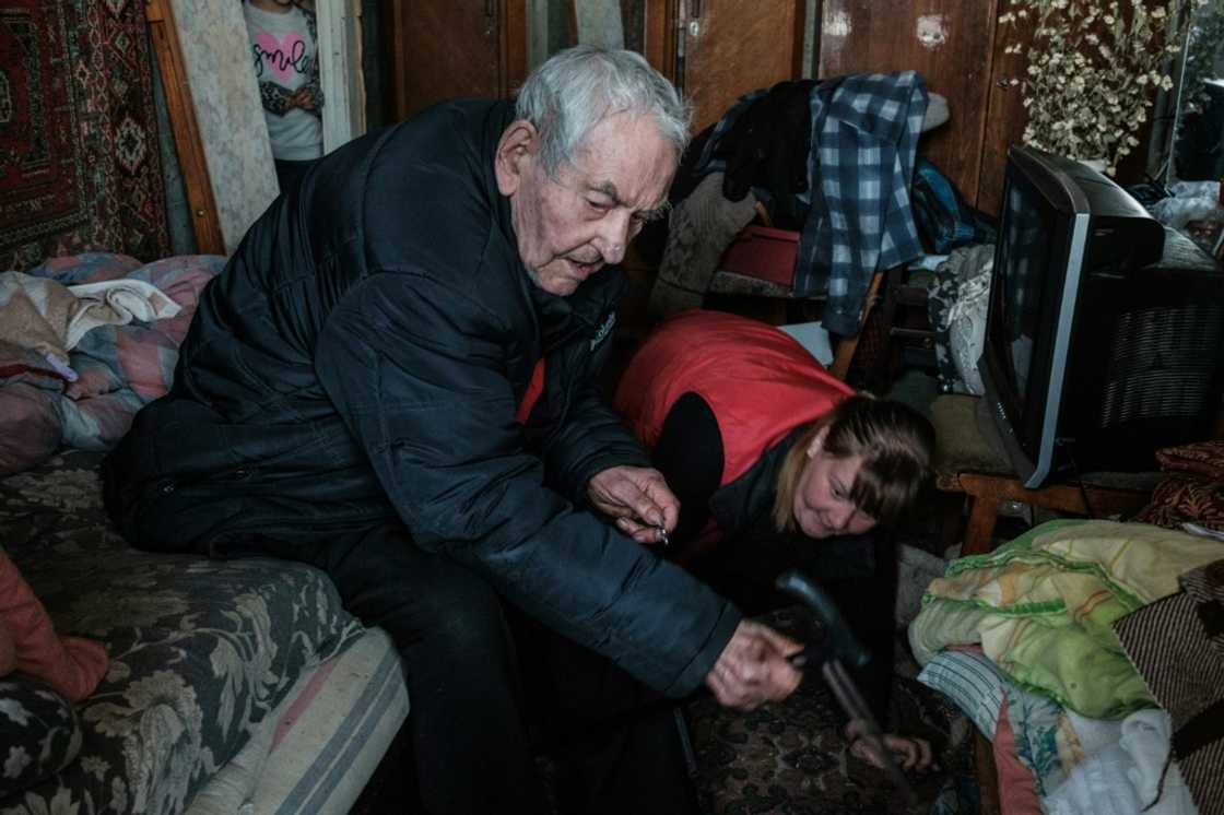 Ivan Solovyankov, 90, asks a family member to find his dog as he evacuates from his apartment in Bakhmut Ivan Solovyankov, 90, asks a family member to find his dog as he evacuates from his apartment in Bakhmut